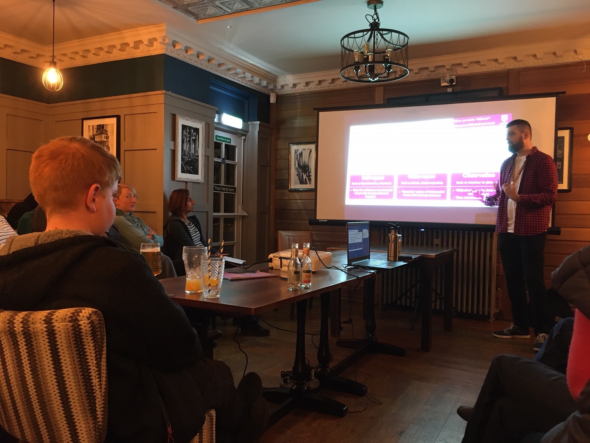 Liam Satchell speaking at the Science Cafe event